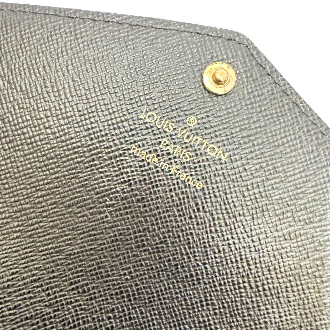 Louis Vuitton Sarah Wallet in Reverse Monogram